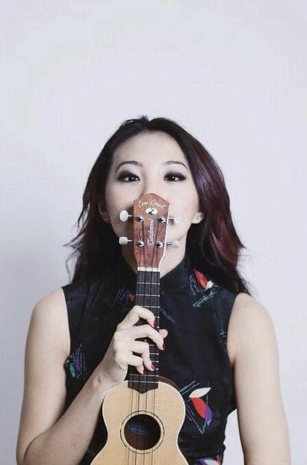 Chelsia playing ukulele